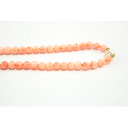 188 - 9ct gold clasped beaded coral necklace (12.2g)