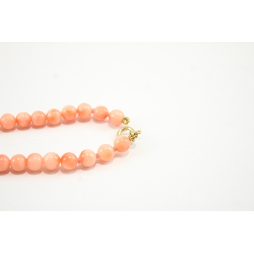 188 - 9ct gold clasped beaded coral necklace (12.2g)