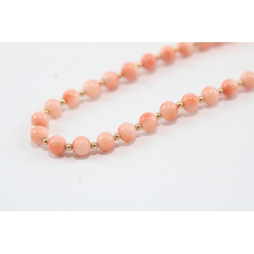 188 - 9ct gold clasped beaded coral necklace (12.2g)