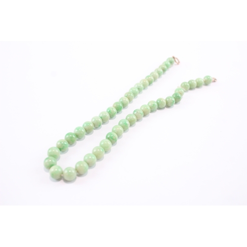 191 - 9ct gold clasped beaded jade necklace (53.5g)