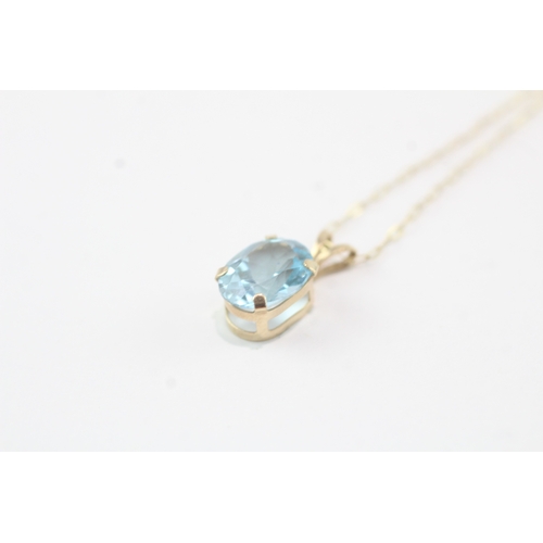 195 - 9ct gold blue gemstone pendant necklace (1g)