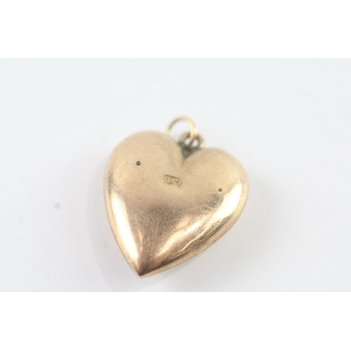 46 - 9ct gold sapphire star set heart locket (2.6g)