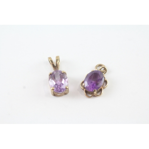 48 - 2 x 9ct gold amethyst set pendants (2g)