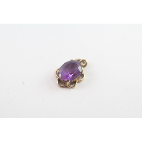 48 - 2 x 9ct gold amethyst set pendants (2g)