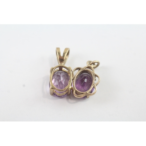 48 - 2 x 9ct gold amethyst set pendants (2g)