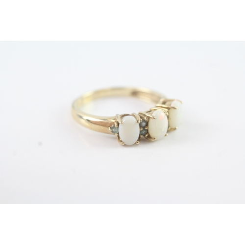 54 - 9ct gold opal & emerald dress ring (2.7g) Size N