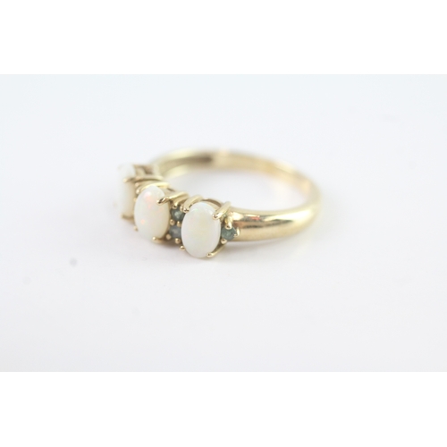 54 - 9ct gold opal & emerald dress ring (2.7g) Size N