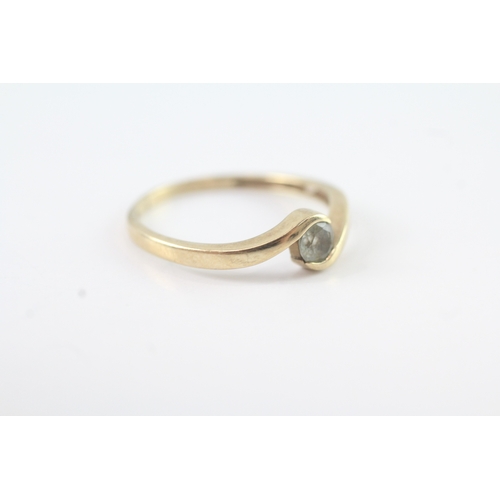 57 - 9ct gold blue gemstone by pass solitaire dress ring (1.8g) Size P