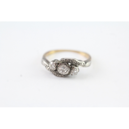 74 - 14ct gold + platinum diamond trilogy by pass ring (2.9g) Size K