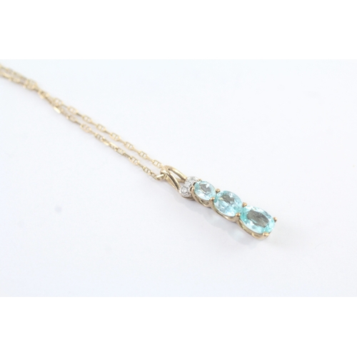 117 - 9ct gold diamond and blue gemstone set pendant necklace (2g)