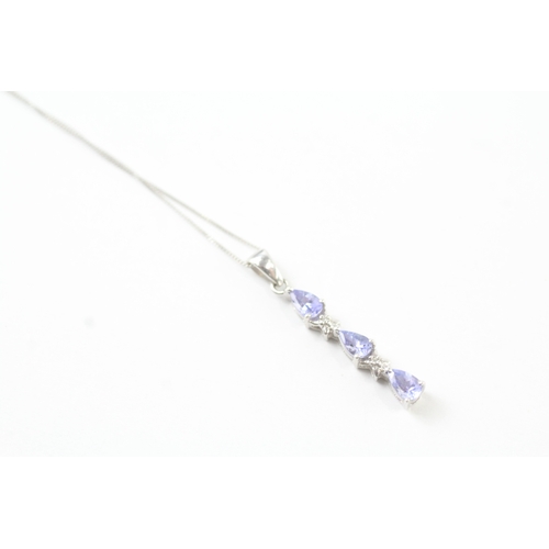 131 - 9ct white gold diamond and tanzanite set pendant necklace (1.7g)