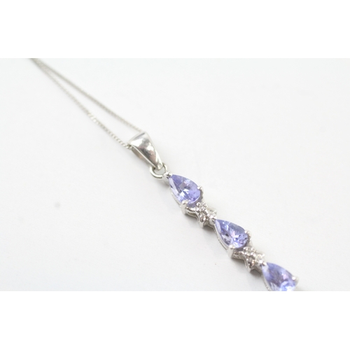 131 - 9ct white gold diamond and tanzanite set pendant necklace (1.7g)