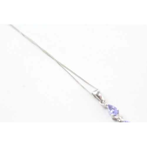 131 - 9ct white gold diamond and tanzanite set pendant necklace (1.7g)