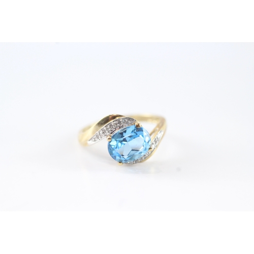 141 - 9ct gold diamond and blue gemstone ring (2.7g) Size M