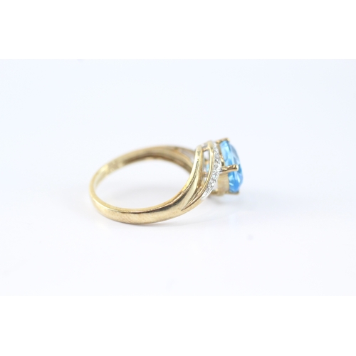 141 - 9ct gold diamond and blue gemstone ring (2.7g) Size M