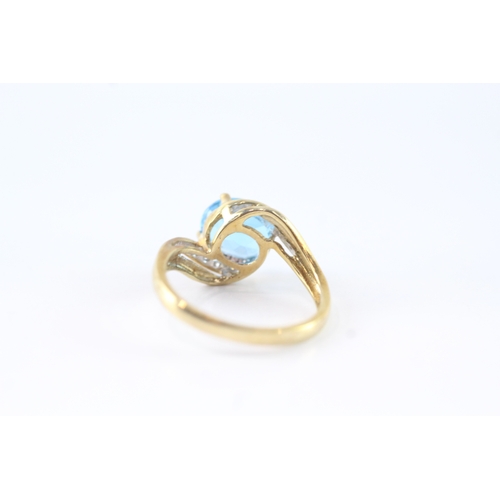 141 - 9ct gold diamond and blue gemstone ring (2.7g) Size M