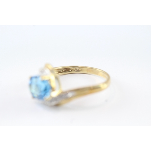 141 - 9ct gold diamond and blue gemstone ring (2.7g) Size M