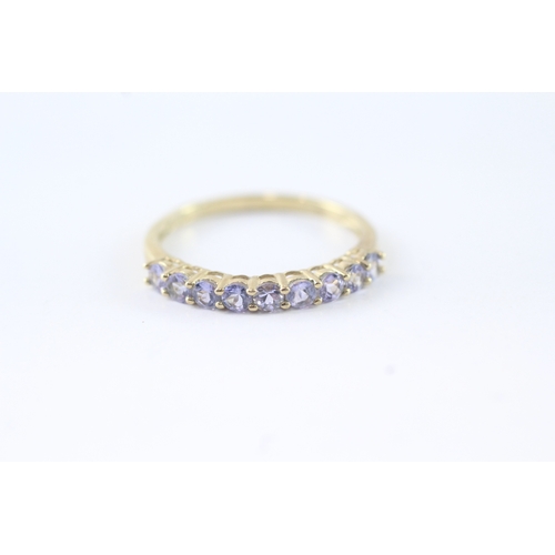 144 - 9ct gold tanzanite row ring (1.4g) Size P