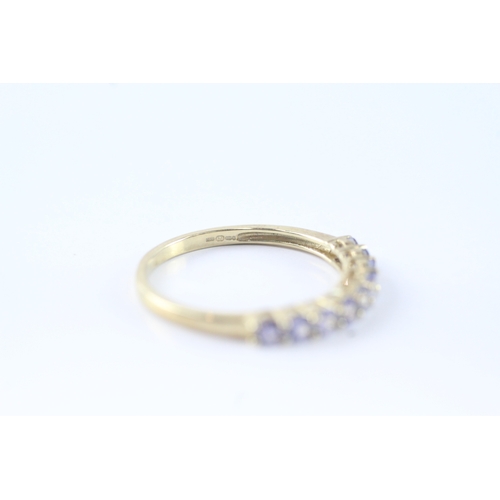 144 - 9ct gold tanzanite row ring (1.4g) Size P