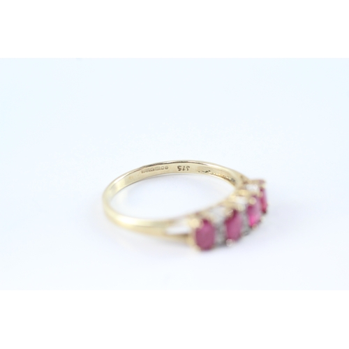 159 - 9ct gold ruby and diamond row ring (2.1g) Size Q