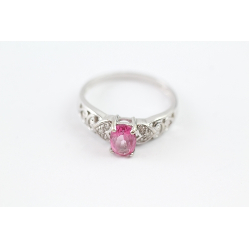 172 - 9ct white gold diamond and pink sapphire open work ring (2.3g) Size P