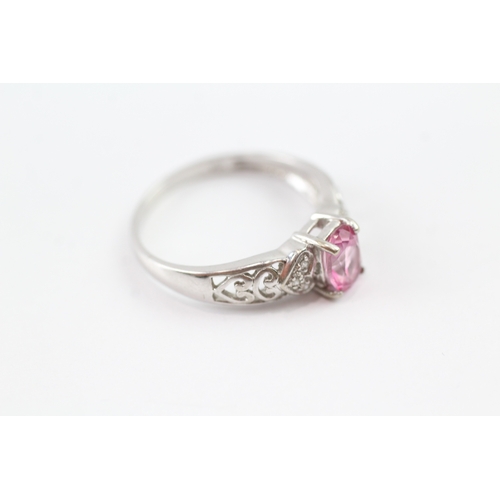 172 - 9ct white gold diamond and pink sapphire open work ring (2.3g) Size P