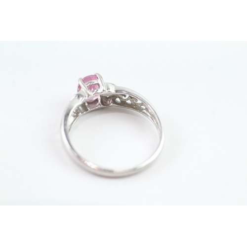 172 - 9ct white gold diamond and pink sapphire open work ring (2.3g) Size P