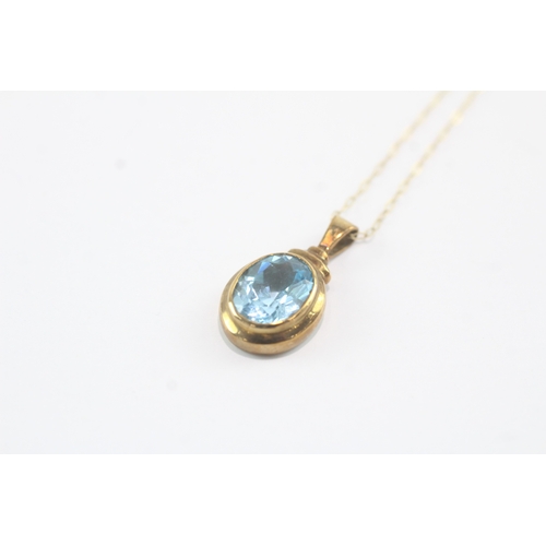 190 - 9ct gold oval cut blue topaz pendant necklace (3g)