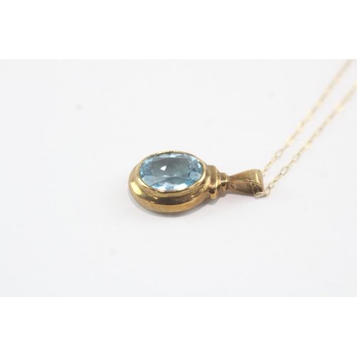 190 - 9ct gold oval cut blue topaz pendant necklace (3g)