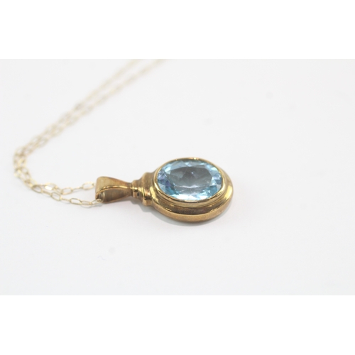 190 - 9ct gold oval cut blue topaz pendant necklace (3g)