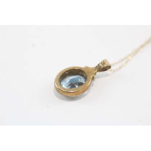 190 - 9ct gold oval cut blue topaz pendant necklace (3g)