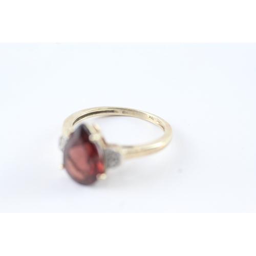 3 - 9ct gold garnet & diamond claw set dress ring (2.5g) Size N