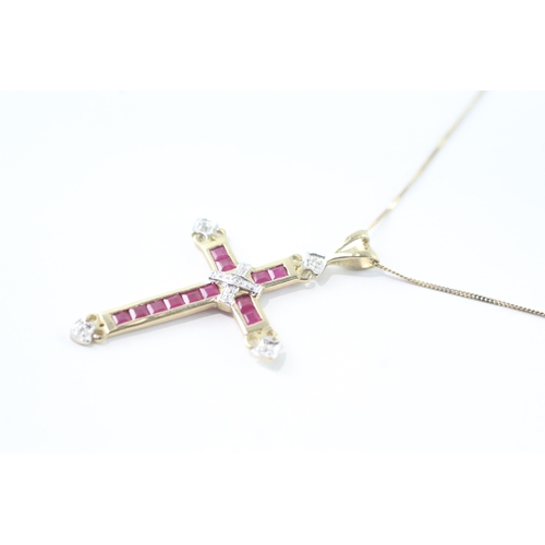 55 - 9ct gold diamond and ruby cross pendant on chain (1.8g)