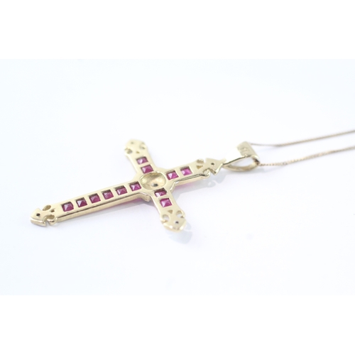 55 - 9ct gold diamond and ruby cross pendant on chain (1.8g)