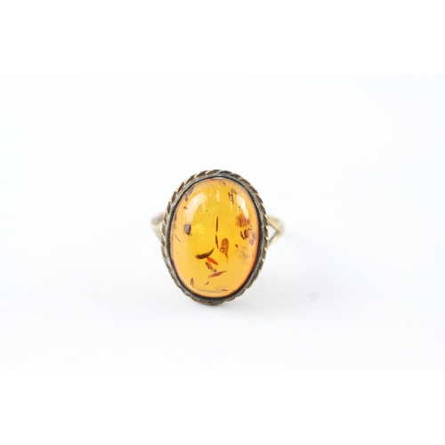 61 - 9ct gold amber cocktail ring (3.5g) Size Q 1/2