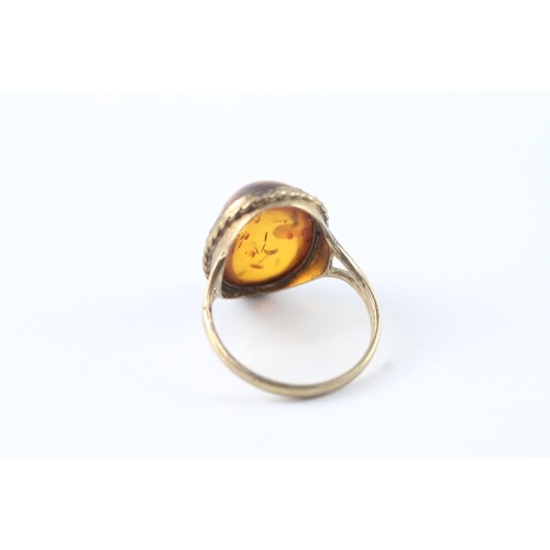 61 - 9ct gold amber cocktail ring (3.5g) Size Q 1/2