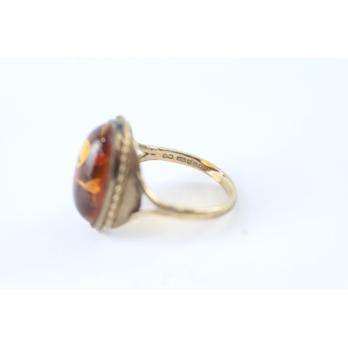 61 - 9ct gold amber cocktail ring (3.5g) Size Q 1/2