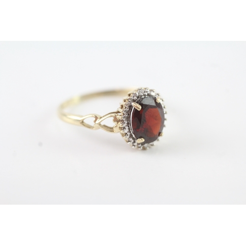 92 - 9ct gold diamond and garnet halo ring (2.2g) Size R 1/2