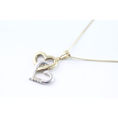 95 - 9ct gold diamond double heart pendant on chain (1.7g)