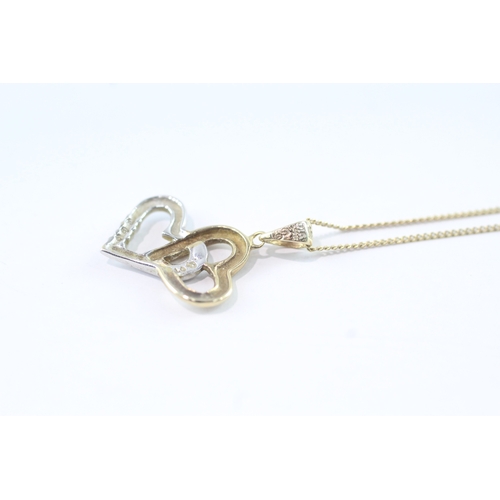 95 - 9ct gold diamond double heart pendant on chain (1.7g)