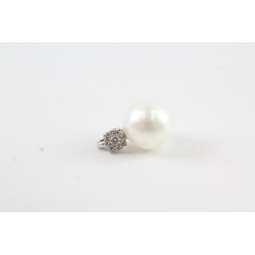 96 - 9ct white gold diamond cluster & pearl pendant (1.3g)