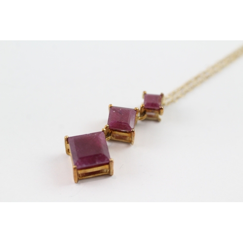 99 - 9ct gold ruby trilogy drop pendant necklace (3.7g)