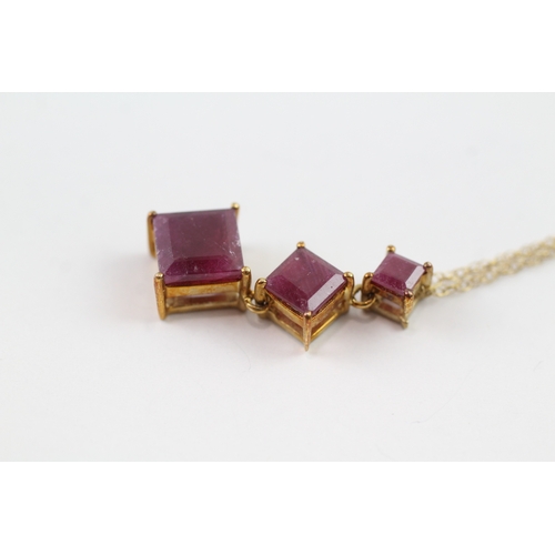 99 - 9ct gold ruby trilogy drop pendant necklace (3.7g)