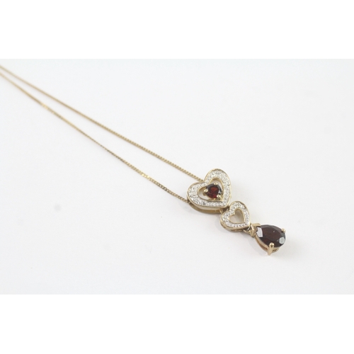 131 - 9ct gold diamond and garnet heart drop pendant on chain (2.3g)