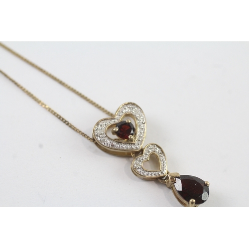 131 - 9ct gold diamond and garnet heart drop pendant on chain (2.3g)