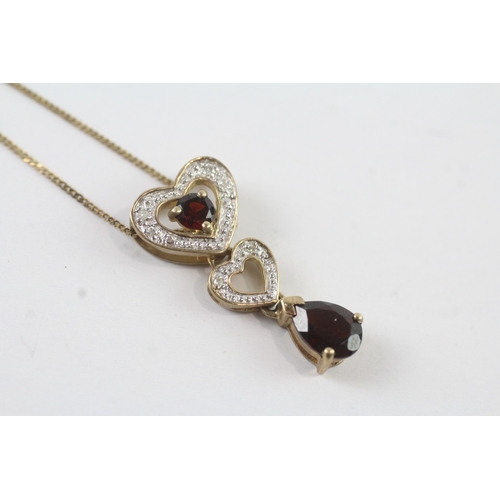 131 - 9ct gold diamond and garnet heart drop pendant on chain (2.3g)