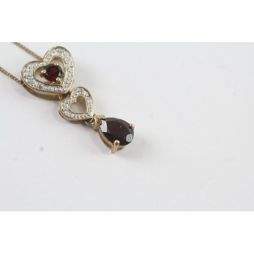 131 - 9ct gold diamond and garnet heart drop pendant on chain (2.3g)