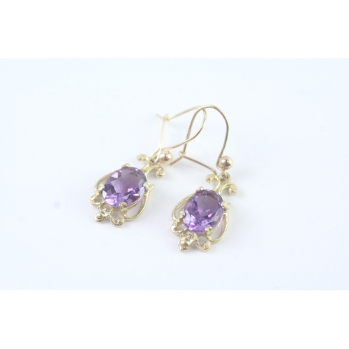 136 - 9ct gold amethyst ornate drop earrings (2.5g)