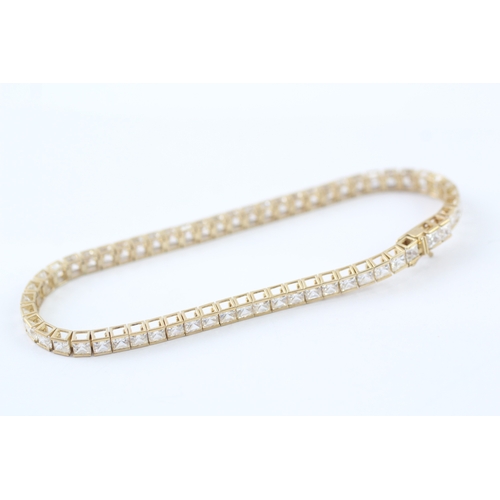 141 - 9ct gold princess cut cubic zirconia set tennis bracelet (10.1g)