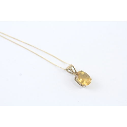 144 - 9ct gold citrine single stone pendant on chain (1.1g)